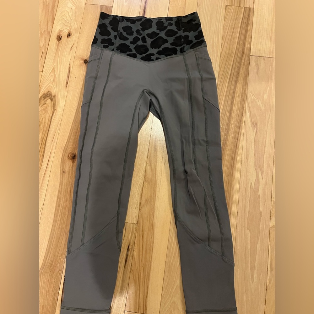 Lululemon grey w/black leopard print waist leggings. Size 4